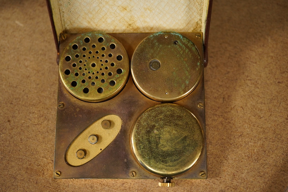 A mid-century Swiss leather cased travelling timepiece compendium with barometer, calendar and thermometer retailed by Ross, 10cm h